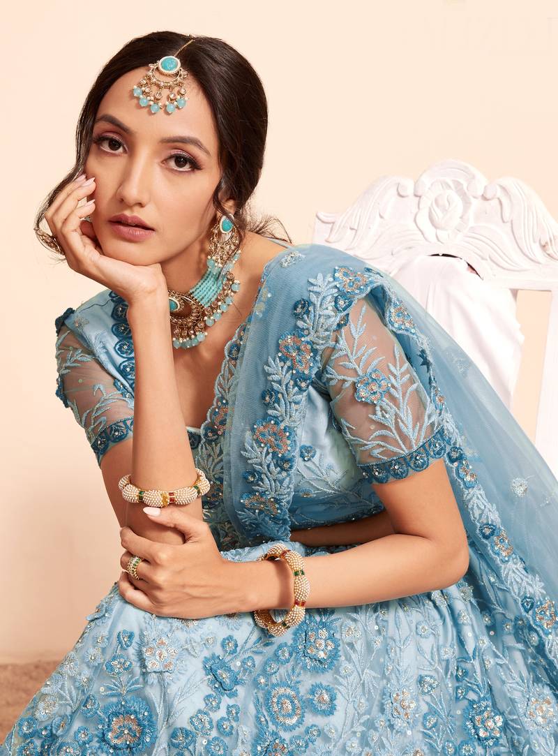 Bewitching Firozi sequins, thread, and zari Embroidered and hand embellished done all over the designer wedding lehenga