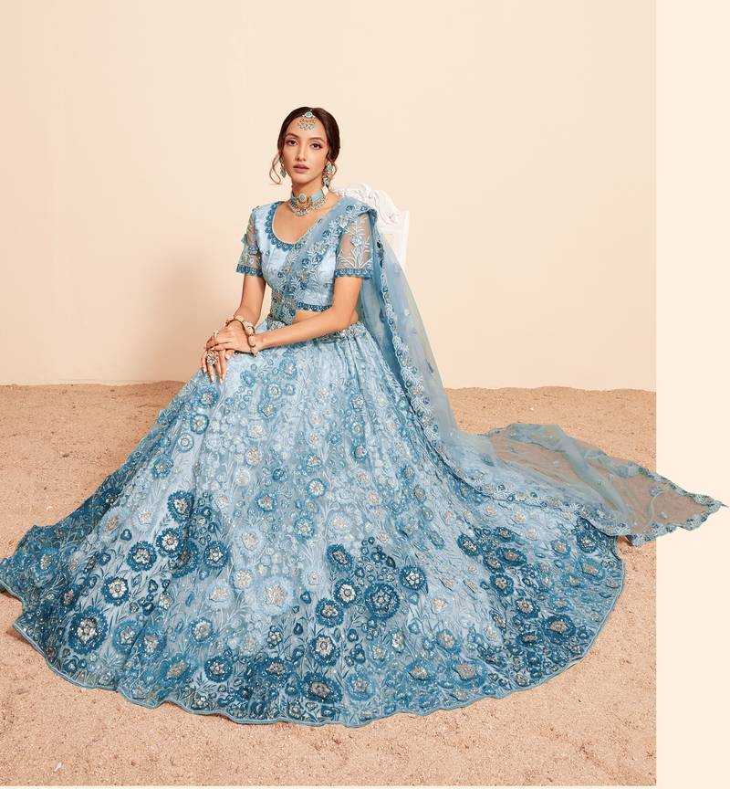 Bewitching Firozi sequins, thread, and zari Embroidered and hand embellished done all over the designer wedding lehenga