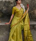 Solid neon green handloom tissue saree with red border