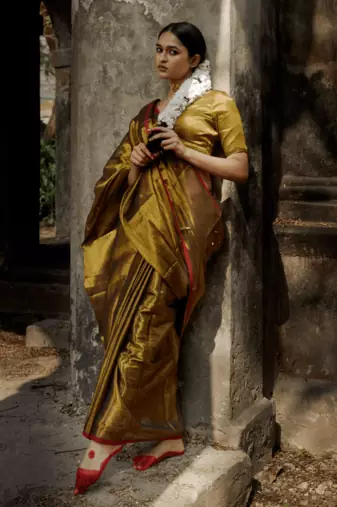 Gold solid  handloom tissue saree with red border
