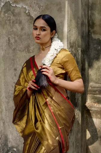 Gold solid  handloom tissue saree with red border