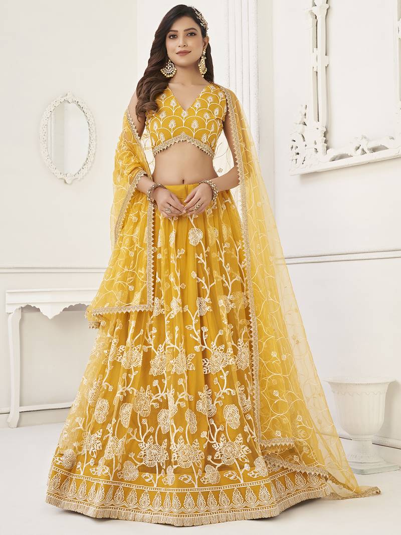 Appealing Mustard Yellow Embroidered Net Haldi Wear Lehenga Choli