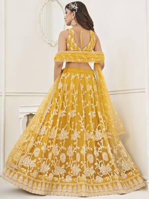 appealing mustard yellow embroidered net haldi lehenga set choli with dupatta 3