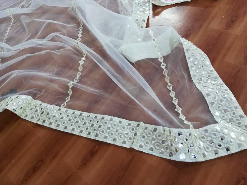 Dazzling Off-white Thread embroidered with papep mirror work georgette semi stitched lehenga choli with wedding