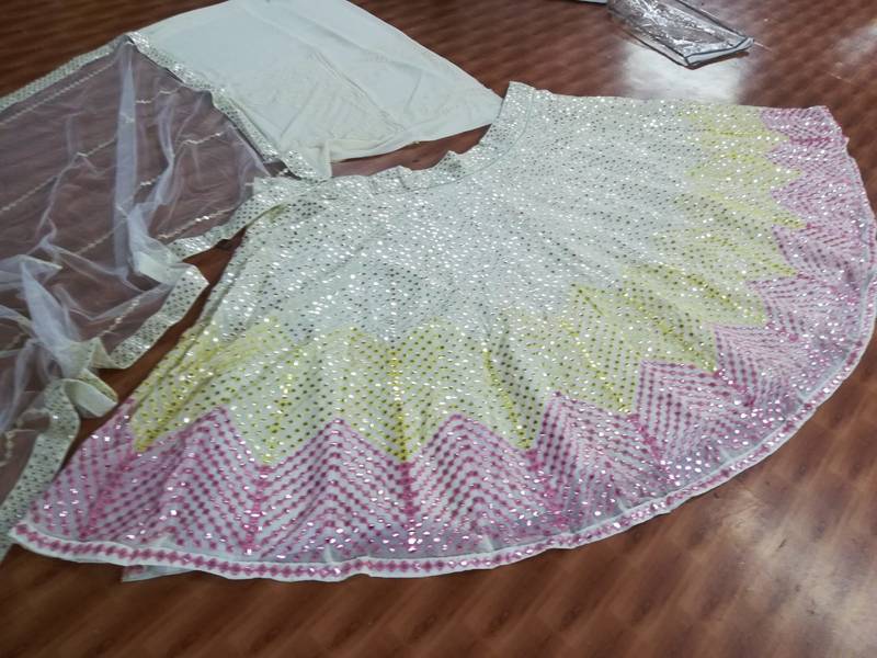 Dazzling Off-white Thread embroidered with papep mirror work georgette semi stitched lehenga choli with wedding