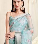 Sky blue organza floral print woven border saree with unstitched blouse piece