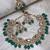 Gold-plated with ad green stones collar bone necklace set with stylish earrings jewellery set for women (ns105678)