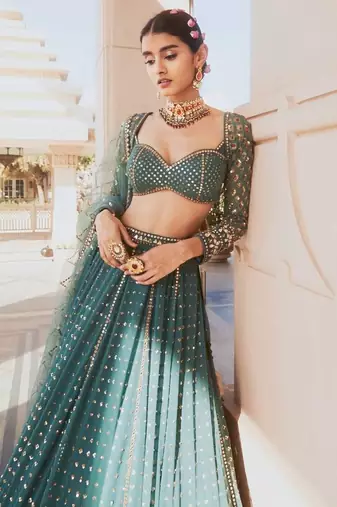 BOTTLE GREEN SEQUINS AND ZARI EMBROIDERED FAUX GEORGETTE LEHENGA SET WITH CHOLI AND DUPATTA