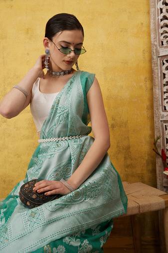 Silk Land Teal Woven Design Cotton Saree With Unstitched Blouse Piece