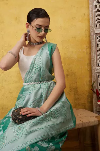 Silk Land Teal Woven Design Cotton Saree With Unstitched Blouse Piece