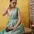 Silk Land Teal Woven Design Cotton Saree With Unstitched Blouse Piece
