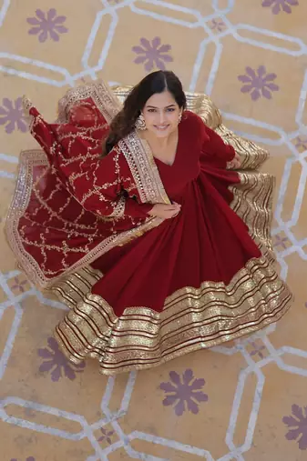 Women's maroon faux blooming with embroidered zari sequins work wedding gown