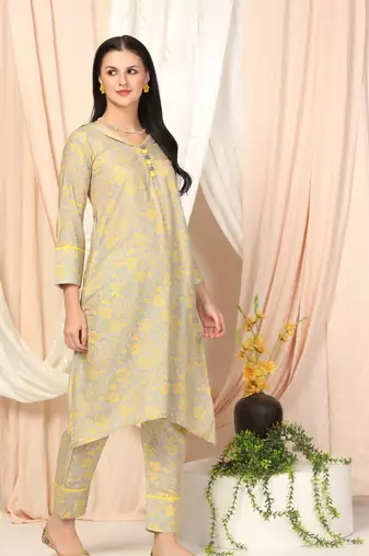 SHADES OF FAASHION Muslin yellow floral suit set.