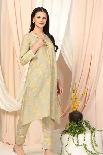 SHADES OF FAASHION Muslin yellow floral suit set.