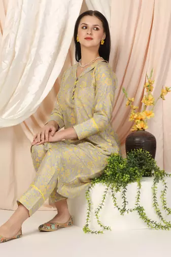 SHADES OF FAASHION Muslin yellow floral suit set.
