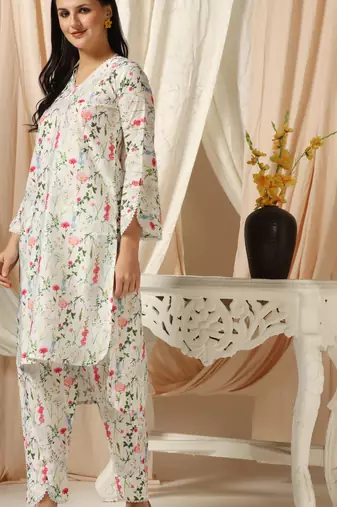 SHADES OF FAASHION Muslin white floral print suit set with lace and pearls.