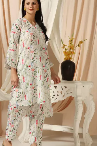 SHADES OF FAASHION Muslin white floral print suit set with lace and pearls.