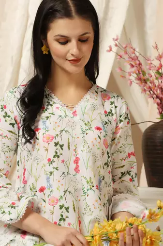 SHADES OF FAASHION Muslin white floral print suit set with lace and pearls.