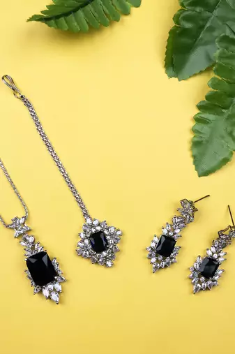 Silver plated blue square ad cz studded leaf pendant set with earrings and maangtika