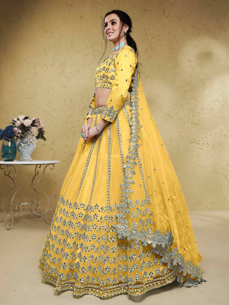 Magnetic Yellow Foil Work Net Haldi Wear Lehenga Choli With Dupatta