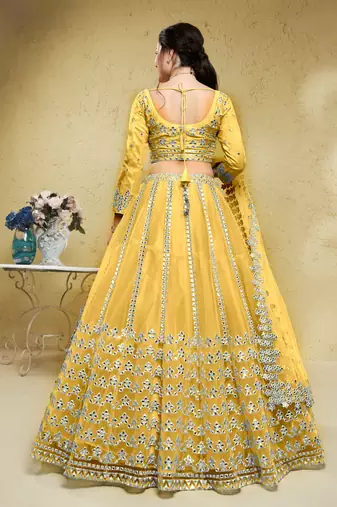 magnetic yellow foil work net haldi lehenga set choli with dupatta with dupatta