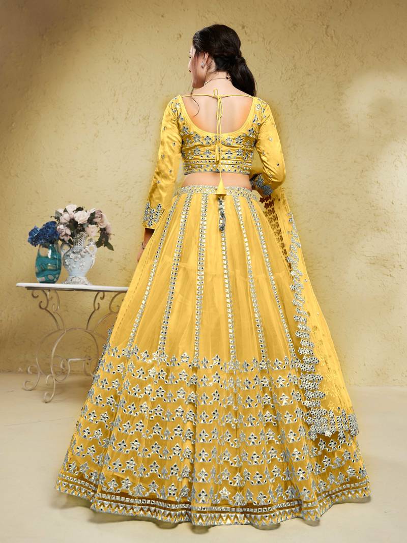 Magnetic Yellow Foil Work Net Haldi Wear Lehenga Choli With Dupatta