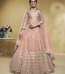 fascinating dusty pink foil work net lehenga set choli with dupatta
