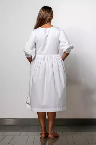 Minimalist white gathered dress