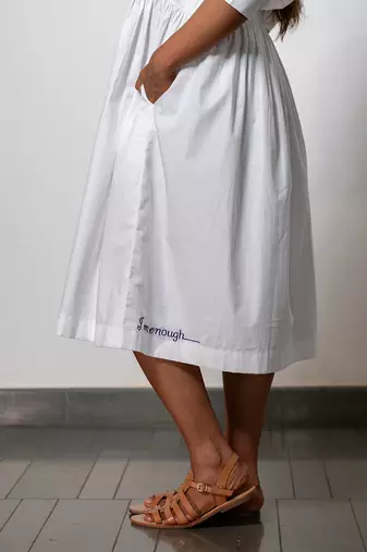 Minimalist white gathered dress