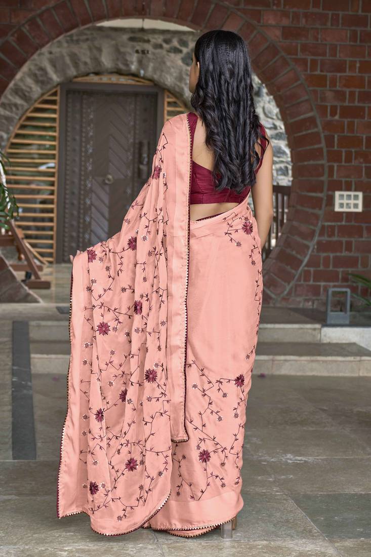 Manohari neon pink poly georgette sequence and embroidery saree with blouse piece