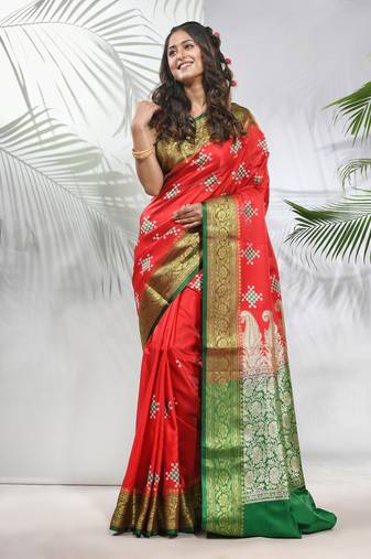 Rust embroidered motifs silk saree with zari borders