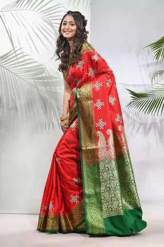 Rust embroidered motifs silk saree with zari borders