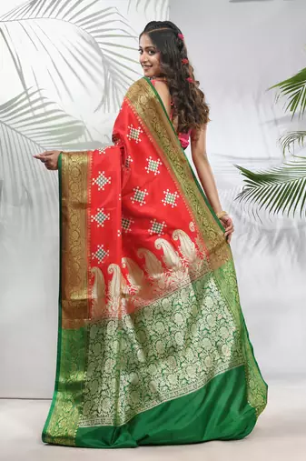 Rust embroidered motifs silk saree with zari borders