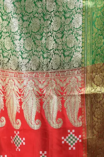 Rust embroidered motifs silk saree with zari borders