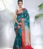 Teal embroidered motifs silk saree with zari borders