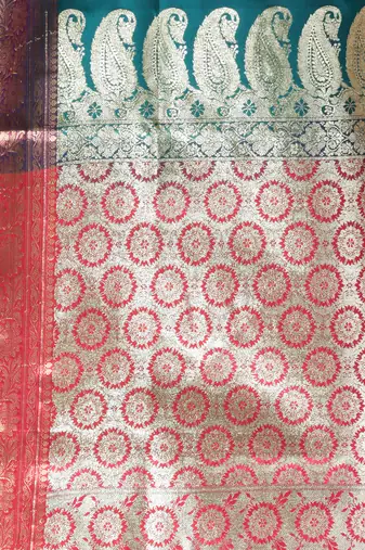 Teal embroidered motifs silk saree with zari borders