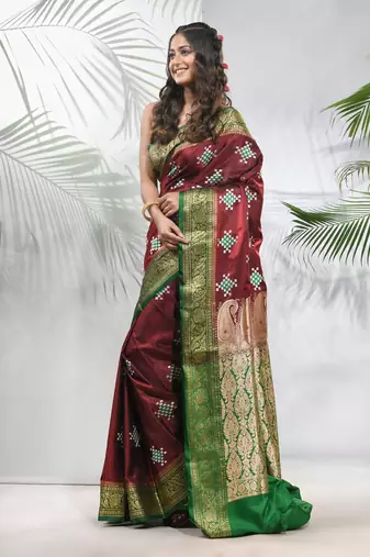 Maroon embroidered motifs silk saree with zari borders