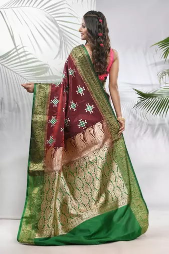 Maroon embroidered motifs silk saree with zari borders