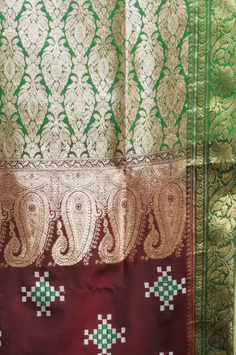 Maroon embroidered motifs silk saree with zari borders