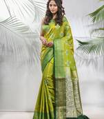 Parrot green embroidered motifs silk saree with zari borders