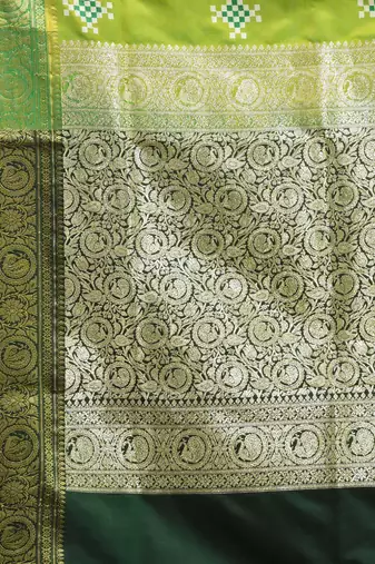 Parrot green embroidered motifs silk saree with zari borders