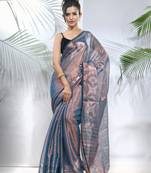 Blue polka dots tissue saree with stripes pallu