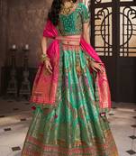 Rama Green Silk Jaquard Woven with Heavy Thread Embroidery, Zari, Sequins With Diamond Work Lehenga Choli