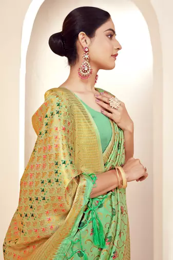 Sangam prints green banarasi silk woven work traditional tassels saree