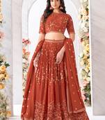 Dark rust colour pure georgette embroidered partywear lehenga