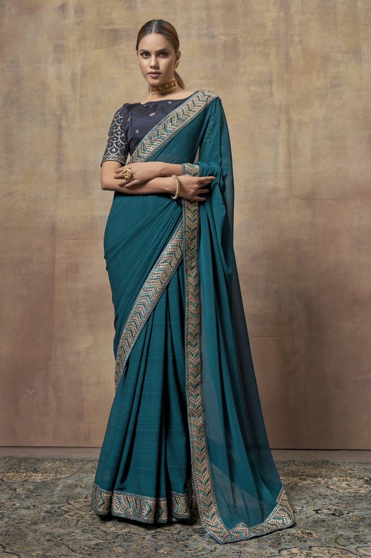 Designer partywear teal colour saree with embroidery work and heavy work blouse