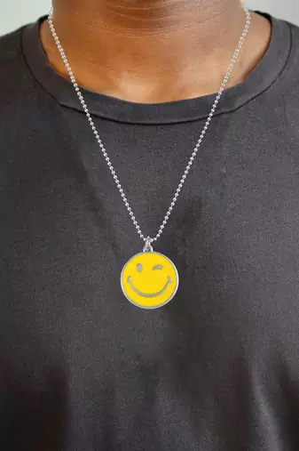 Stainless steel winking emoji pendant
