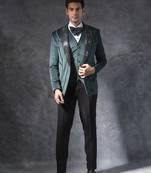 Bottle green zardosi embroidered tuxedo suit on suede fabric