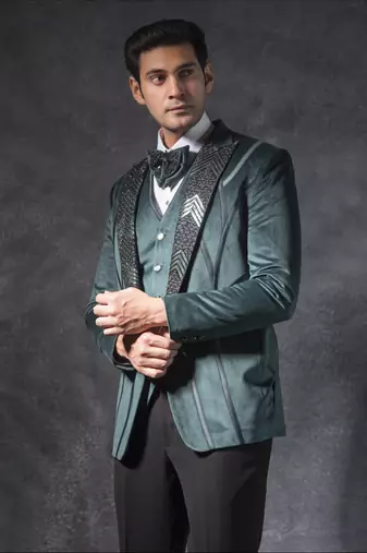 Bottle green zardosi embroidered tuxedo suit on suede fabric