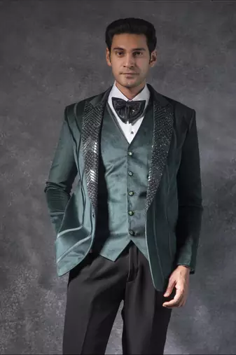 Bottle green zardosi embroidered tuxedo suit on suede fabric